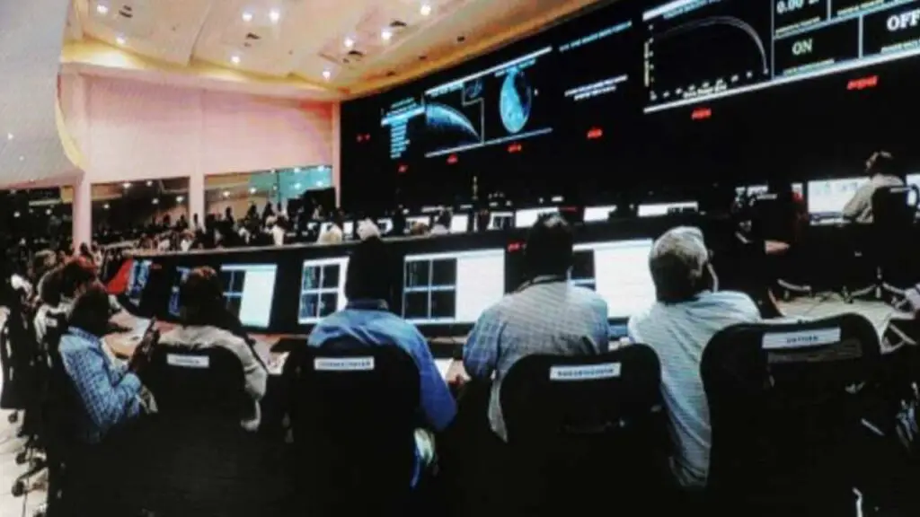 Image of scientists celebrating at the ISRO control center